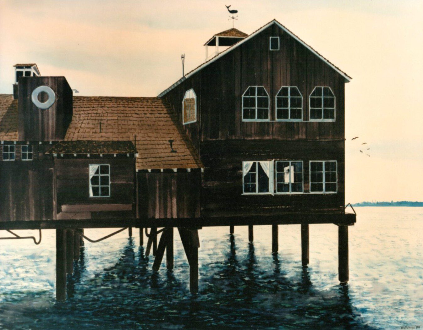 Old wooden house on stilts over water at sunset.